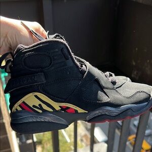 Black High-Top Sneakers with Red Accents